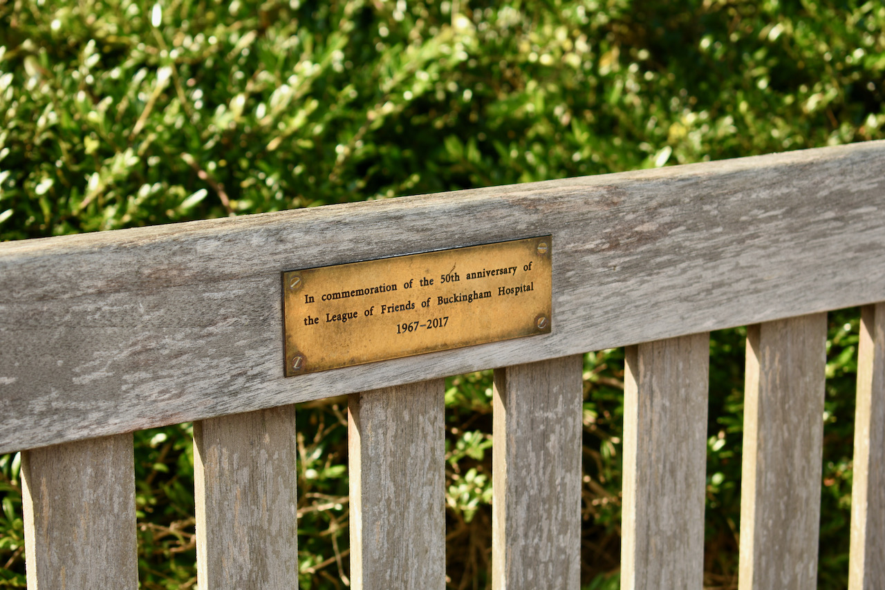 A bench with an in memoriam plaque