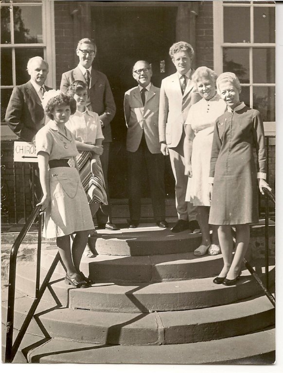 The opening of the new outpatient facility in 1977 - back row - L to R - Mr Ken Oliver administrator, Mr Paul Lewis consultant obstetrician and gynaecologist, Mr Gilbert Cantell treasurer League of Friends, Dr Christopher Brown. Middle row - Mrs Susan Scobbie secretary/receptionist, Mrs Edna Embleton chair of the League. Front row - Mrs Barbara Snook outpatient nurse and Miss Margaret Howarth matron.